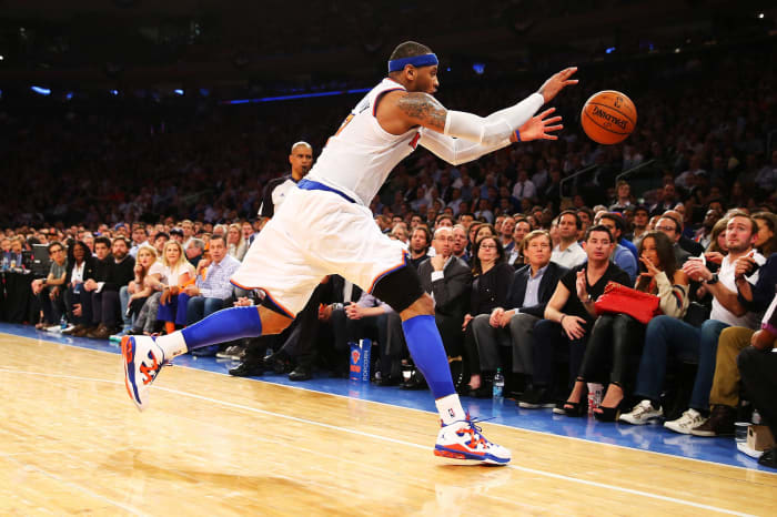 Carmelo Anthony blocks ball, saves ball, wipes out several fans