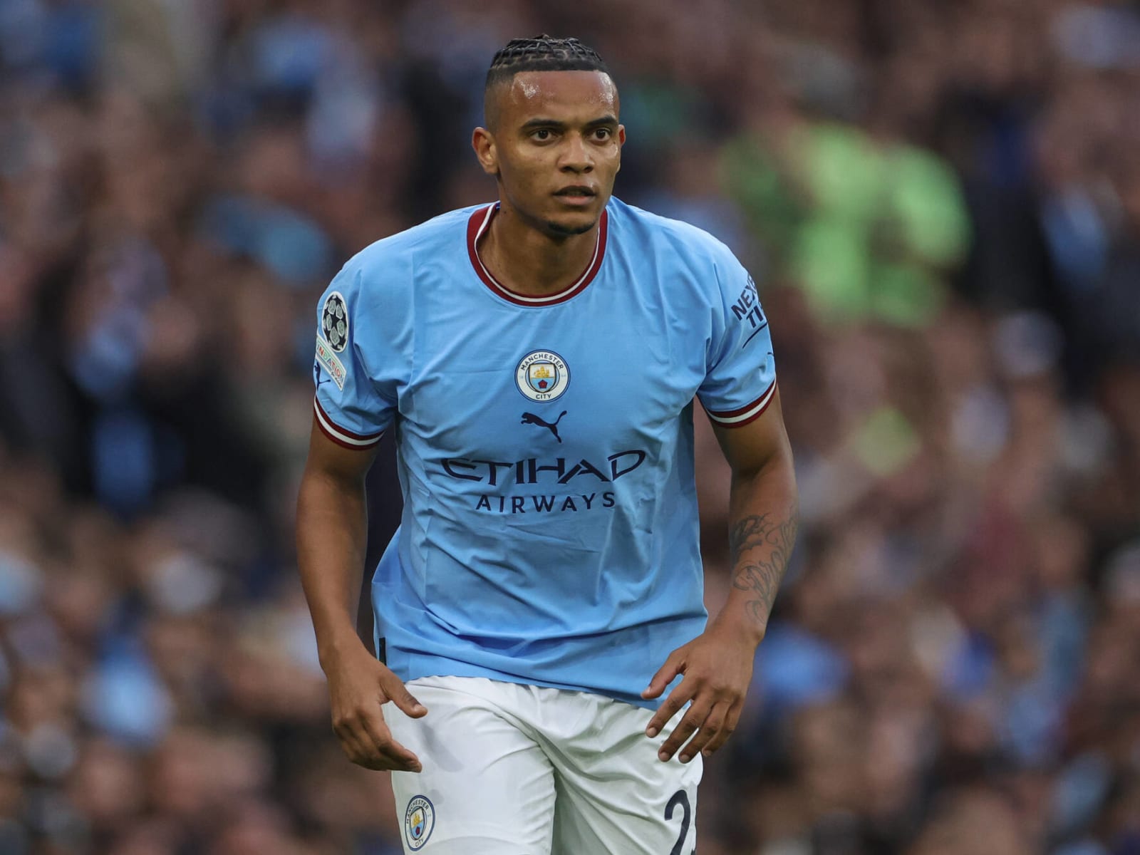 Manchester City's Manuel Akanji heads the ball during the
