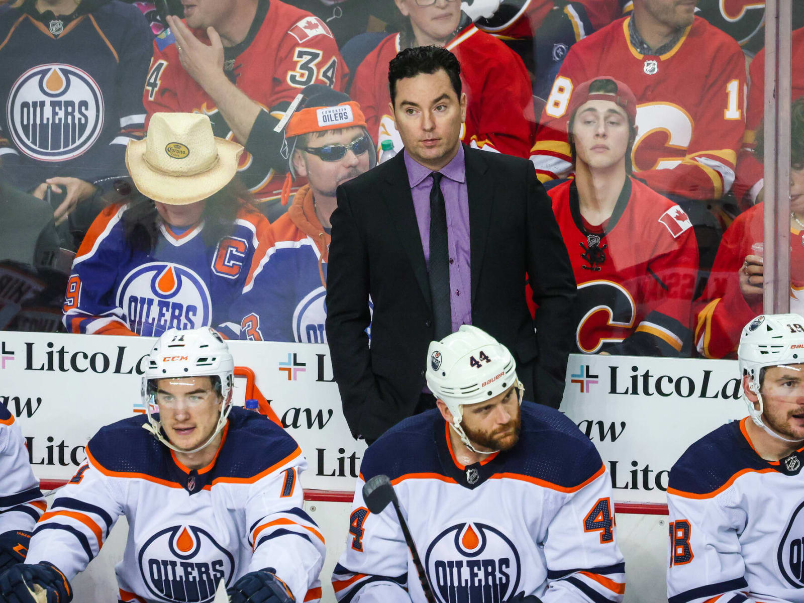 Edmonton Oilers coach Jay Woodcroft stands behind the bench during