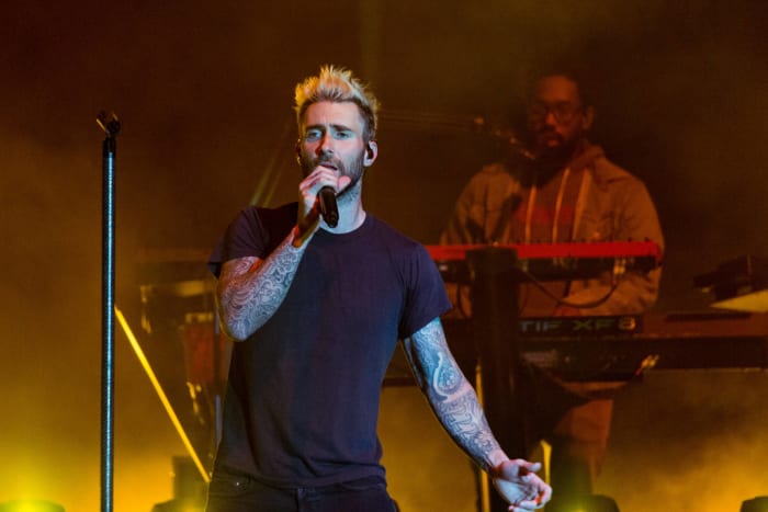 What will be the predominant color of Adam Levine's top at the start of the halftime show?