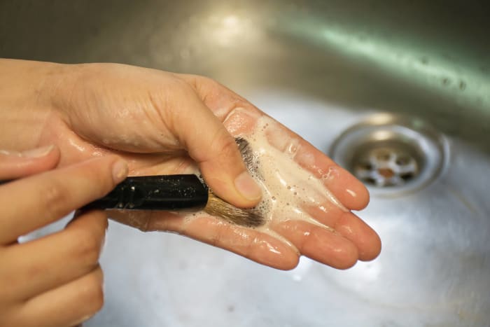 Clean your makeup brushes with olive oil and dish soap