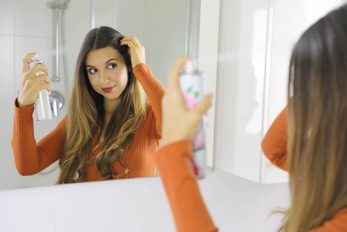 Use dry shampoo before your hair gets greasy