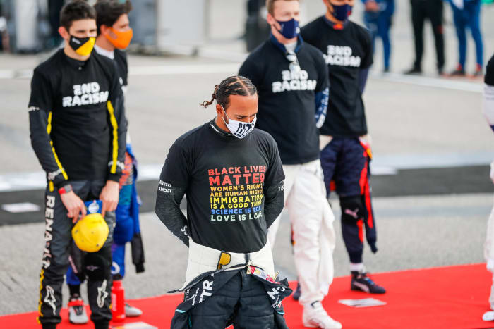 September: Lewis Hamilton takes protest to podium