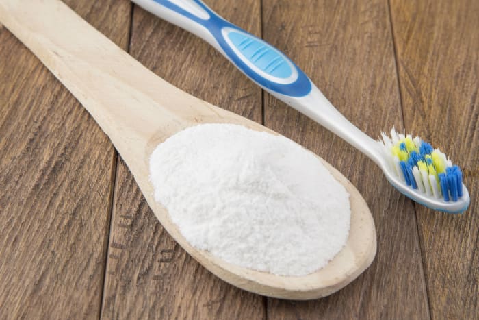 Use baking soda to scrub and whiten teeth