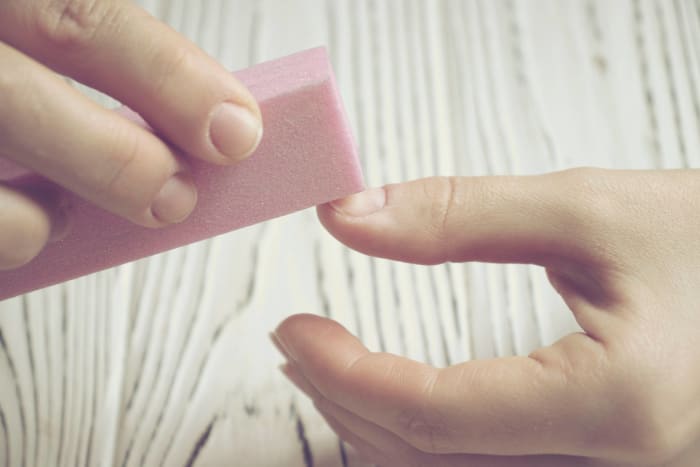 Buff nails to make polish last longer