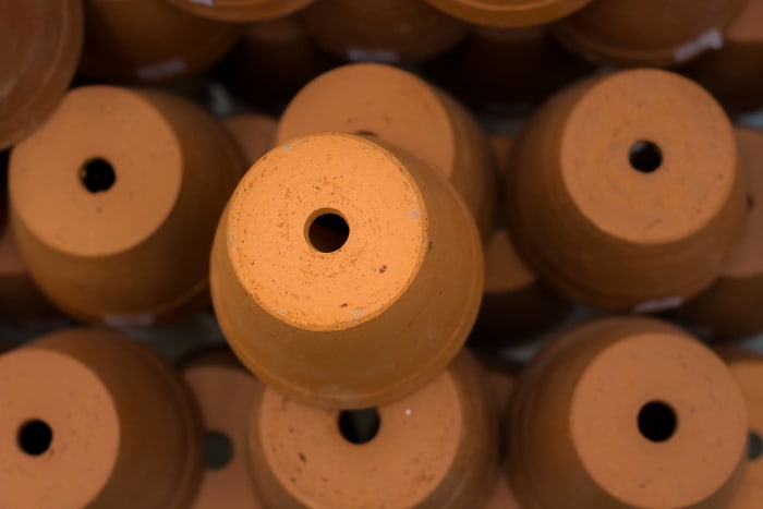 Consider drilling drainage holes, or keep ‘em in the nursery pots