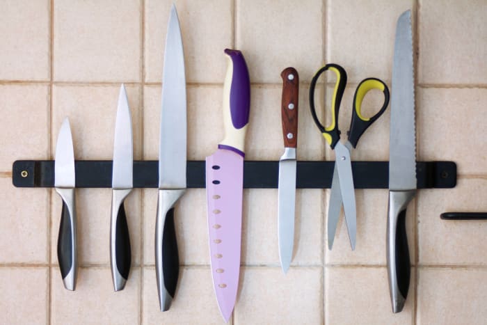 Use magnetic strips to hang knives, spice jars, and other essentials