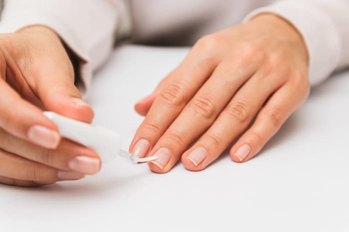 Use strengthening polishes to harden flimsy nails