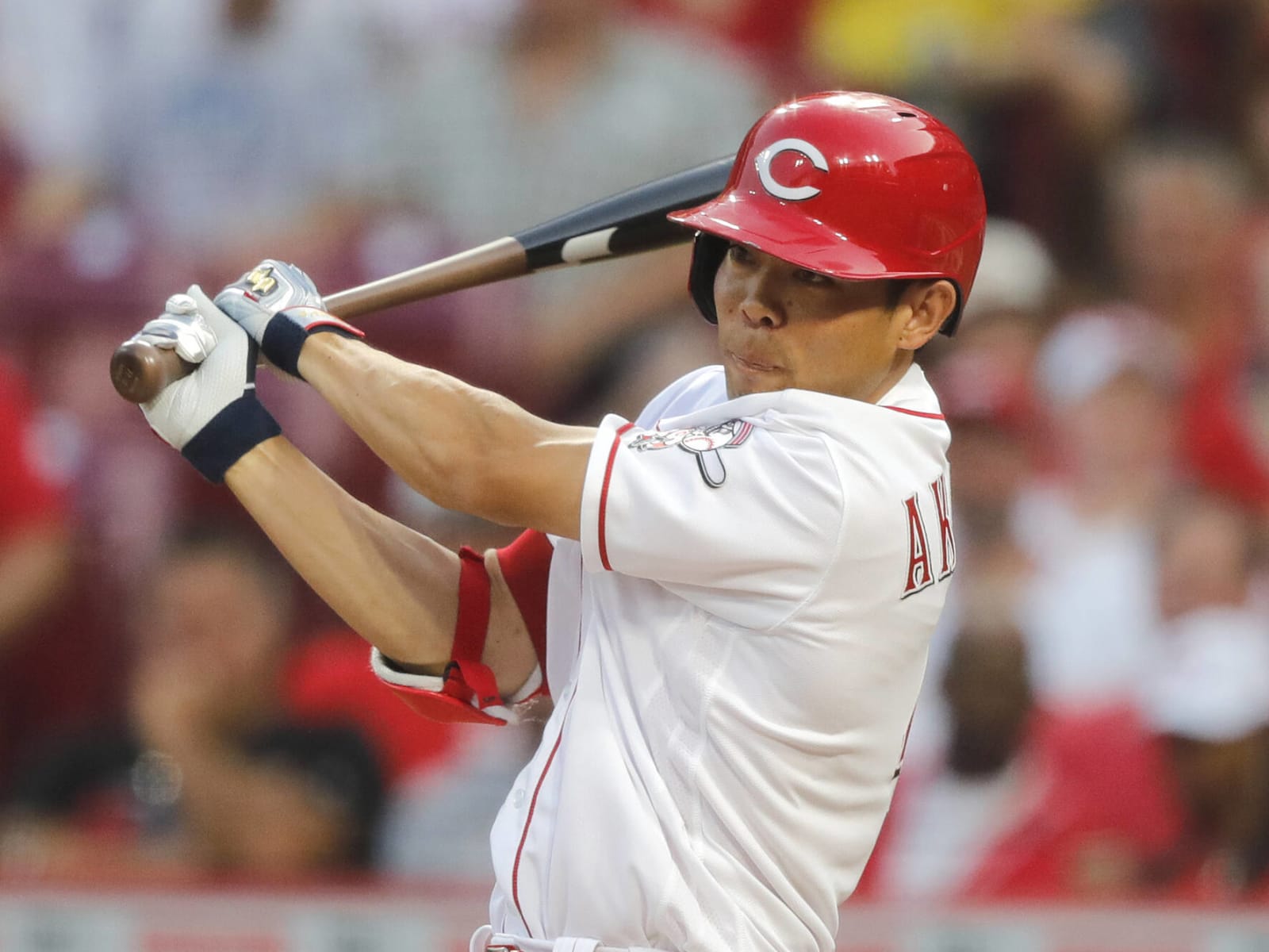 Cincinnati Reds outfielder Shogo Akiyama singles to left field in the