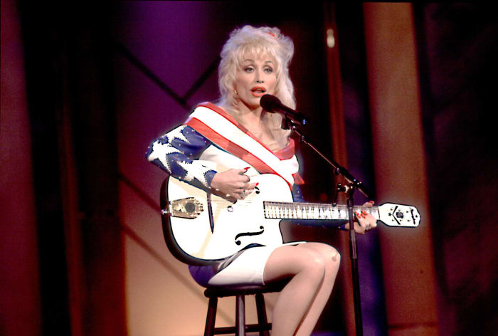 1989: Parton gives $500 scholarships to every high school student in Sevier County