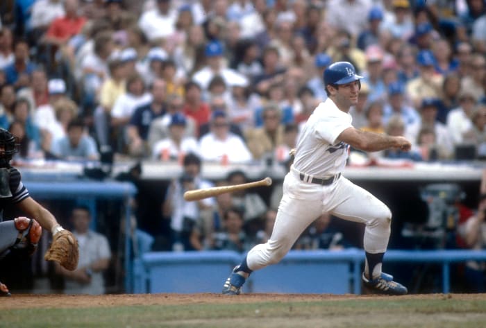 Baseball player Steve Garvey holds up his new jersey while wearing News  Photo - Getty Images