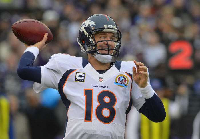 Peyton Manning signs with the Denver Broncos