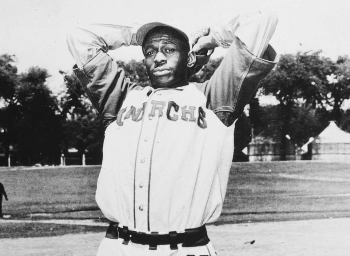 Satchel Paige Pitching For St. Louis by Bettmann