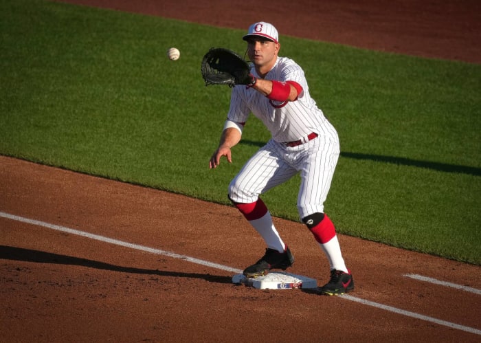 Joey votto Cincinnati Reds Unsigned Hitting in White Jersey Photograph