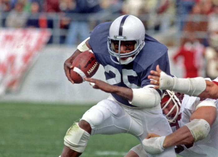 Running back Curt Warner of the Seattle Seahawks moves the ball