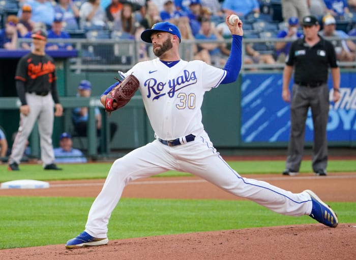 Kansas City Royals pitcher Danny Duffy talks to a fan wearing a