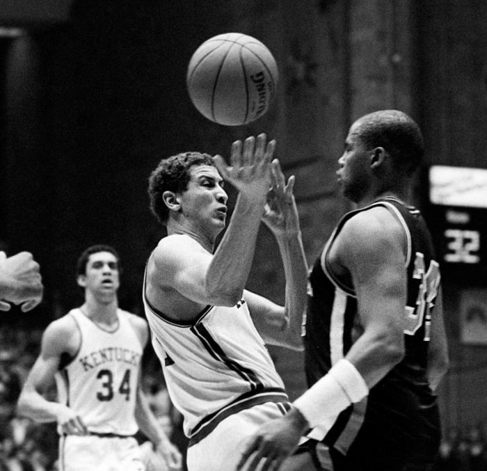 Hersey Hawkins of the Charlotte Hornets makes a pass around Sam