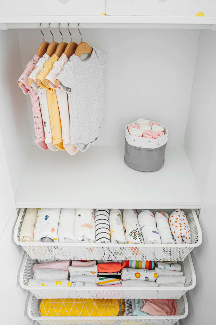 Keep clothing organized with bins and a system