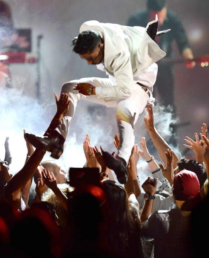 Miguel tried to jump off a stage, leg slammed a fan's head (May 20, 2013)