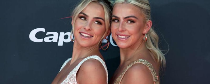 Haley and Hanna Cavinder pose together in fun Miami Hurricanes uniform photos