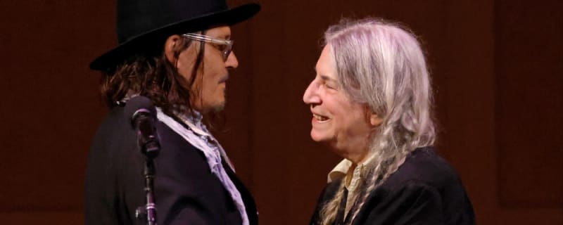 Johnny Depp joins Patti Smith on stage at London Palladium concert