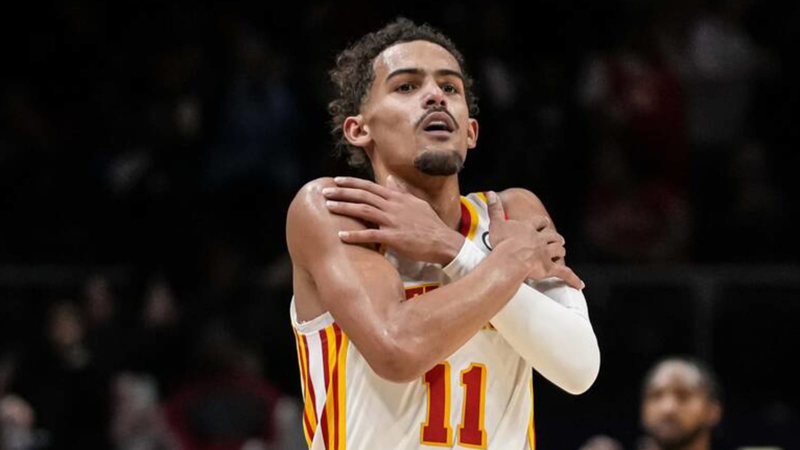 Hawks' Young reacts to him throwing ball into the crowd