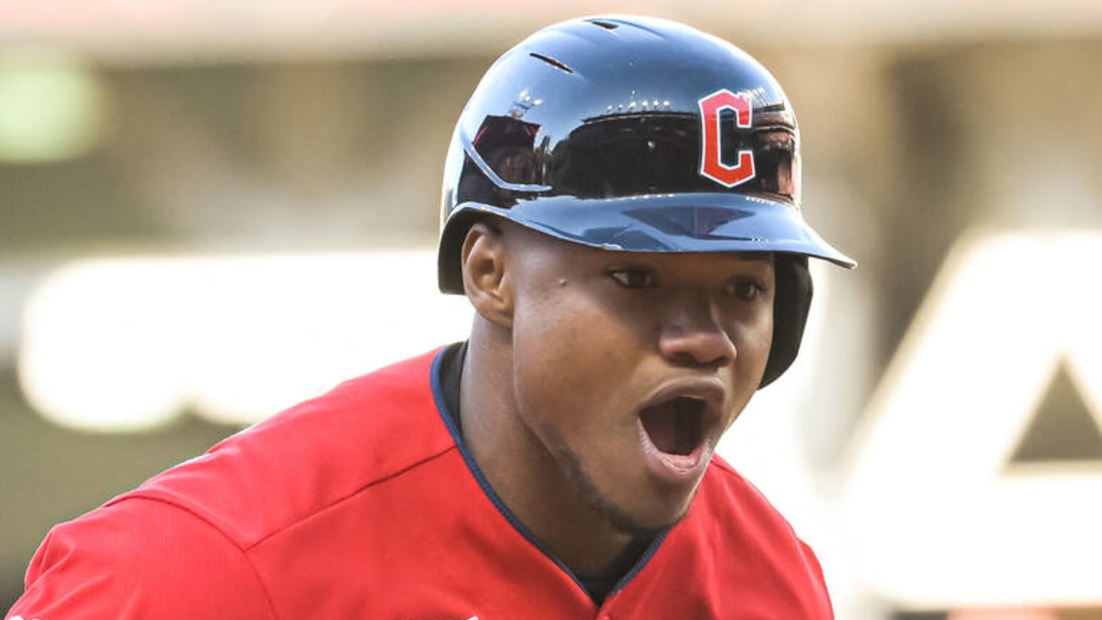 Cleveland Guardians right fielder Oscar Gonzalez flips his bat