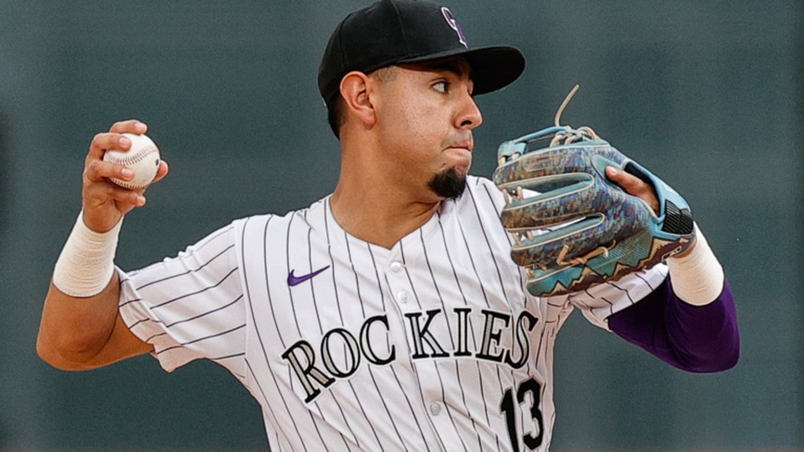 Rockies designate utilityman for assignment