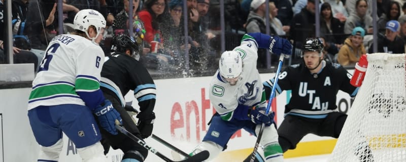 Utah escapes two-goal hole, stuns Canucks in OT