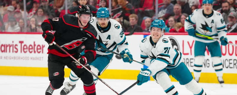 Hurricanes score twice in 3rd to slip past Sharks