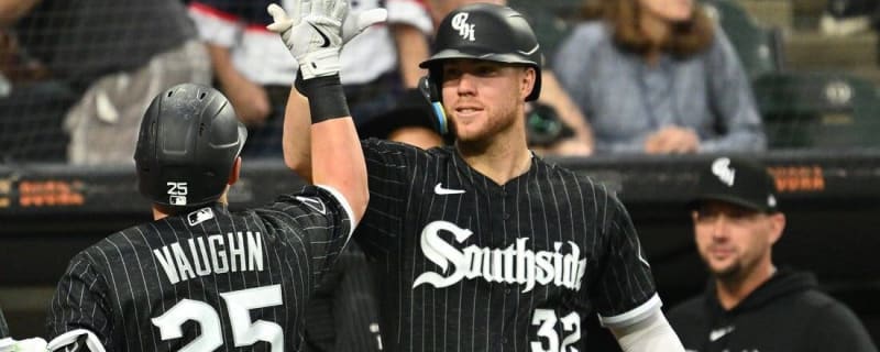 Chicago White Sox's Romy Gonzalez, right, celebrates with first base coach  Daryl Boston after hitting a single during the ninth inning of the team's  baseball game against the Minnesota Twins in Chicago