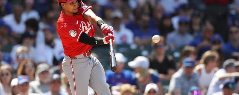 Reds rally, then hold off Cubs to open series