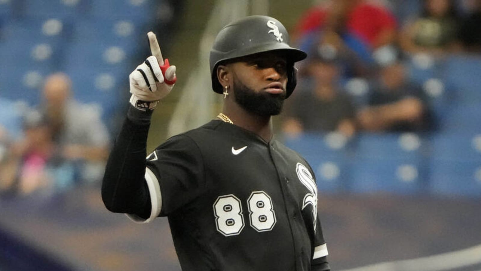 Luis Robert of the Chicago White Sox looks on from the dugout