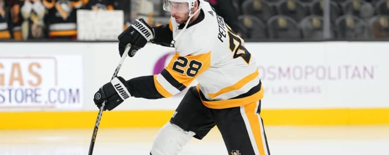 Pittsburgh Penguins' Marcus Pettersson (28) clears Vegas Golden