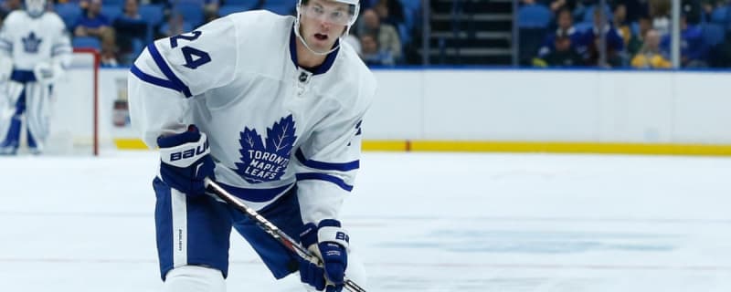 Former Leafs forward Peter Holland sticks up for Cedric Pare following collision with Patrik Laine