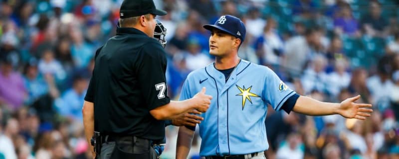 Tampa Bay Rays pitching coach Kyle Snyder, left, looks on as Shane  McClanahan holds his all-star jersey before a baseball game against the  Baltimore Orioles Saturday, July 16, 2022, in St. Petersburg