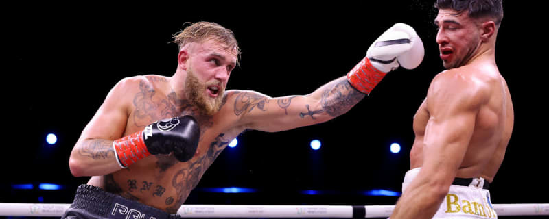 Jake Paul punches Tommy Fury during the Cruiserweight Title fight between them at the Diriyah Arena on February 26, 2023 in Riyadh, Saudi Arabia.