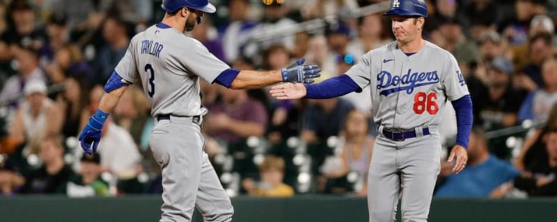 Chicago Cubs players try to catch Los Angeles Dodgers' Paco