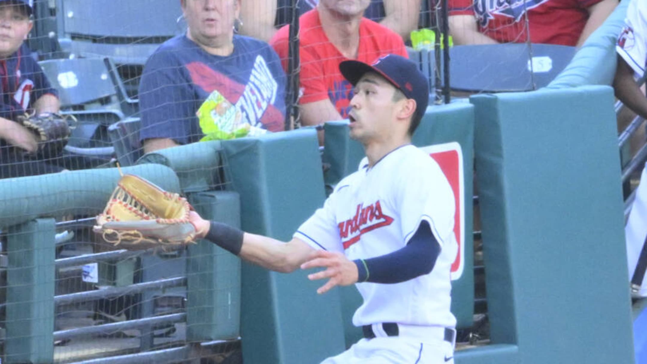 Steven Kwan takes a foul ball off the top of his head