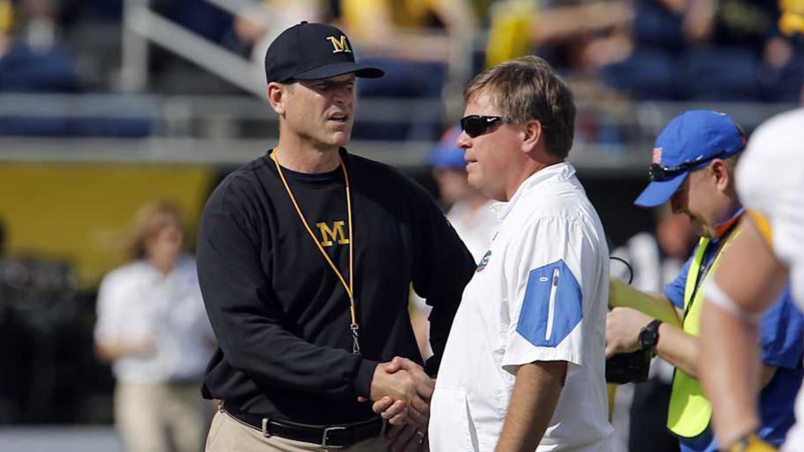  Amid NCAA investigation, former Michigan Football coach announces retirement