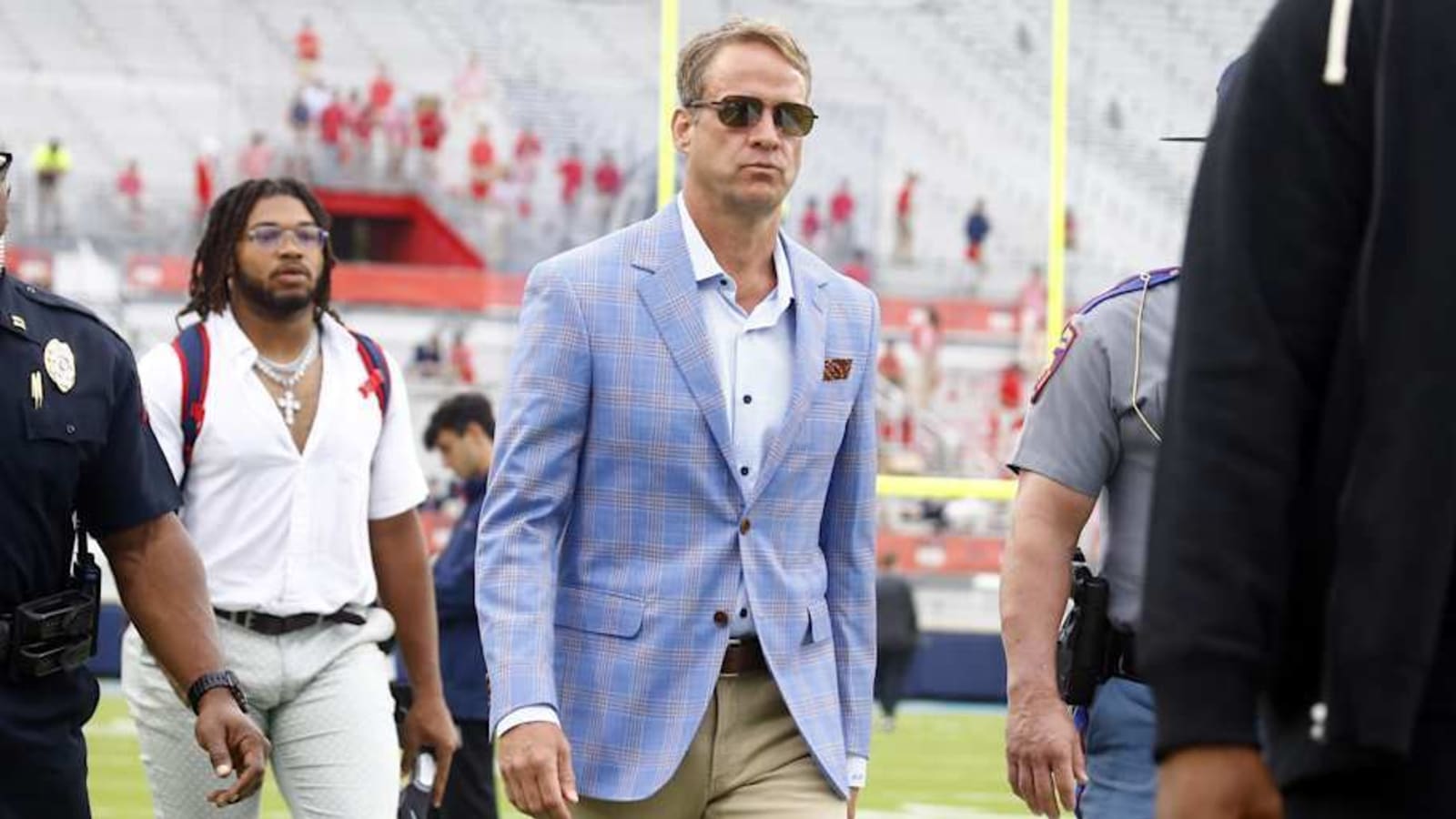 Landry Kiffin’s subtle brag posing with pops Lane Kiffin in strapless minidress