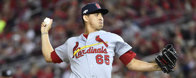 Cardinals reliever Gallegos gets wiped down by umpire after using rosin bag  on his left arm