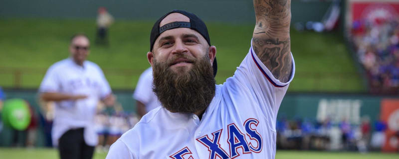 Cubs 1B coach Mike Napoli cup checks C Yan Gomes