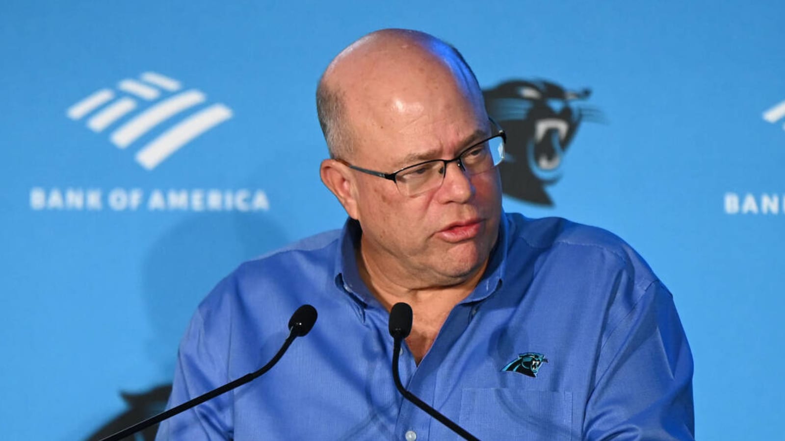 NFL fines Panthers owner after throwing drink at fan