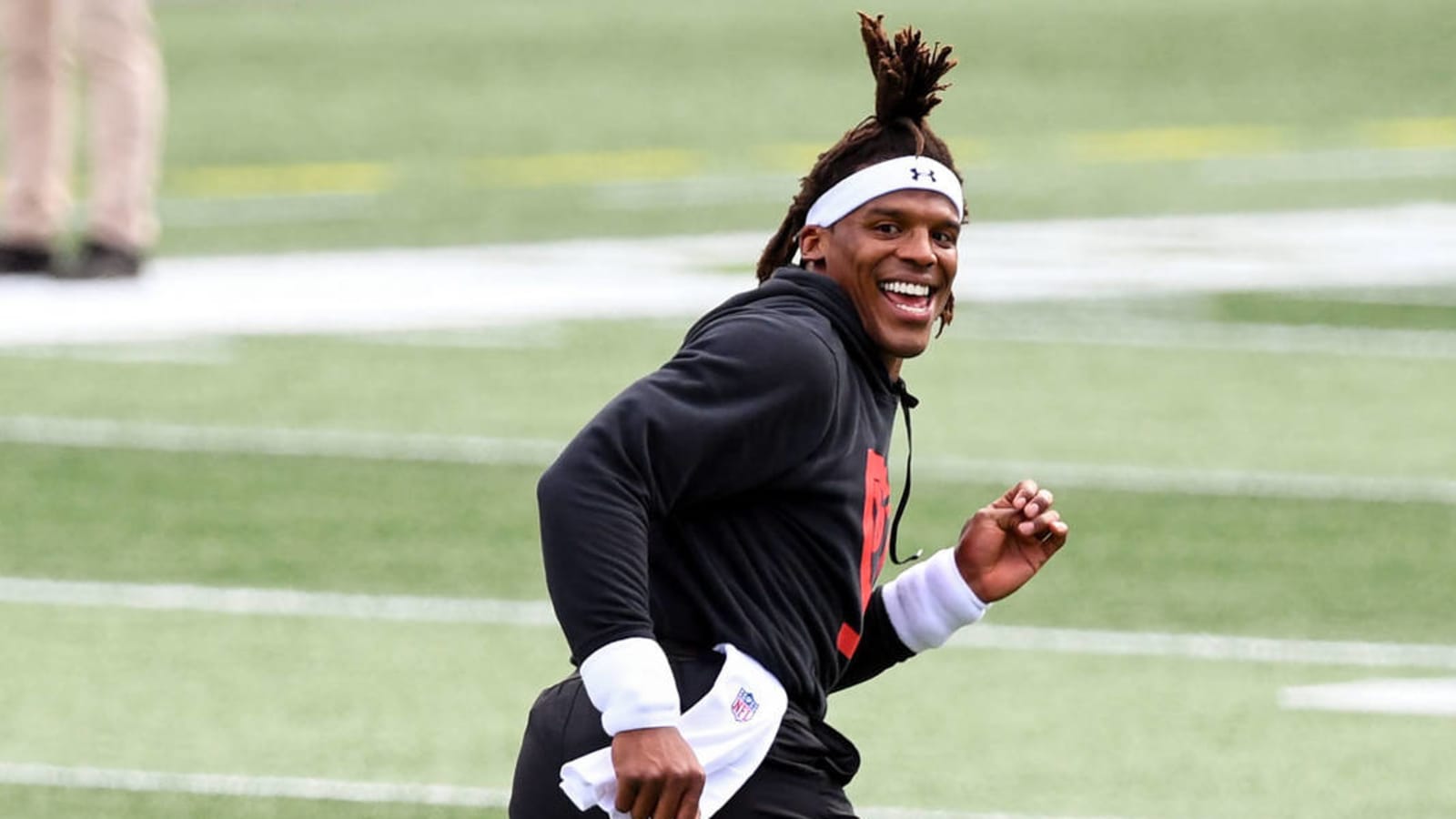 Cam Newton rocks loud yellow outfit before Patriots debut