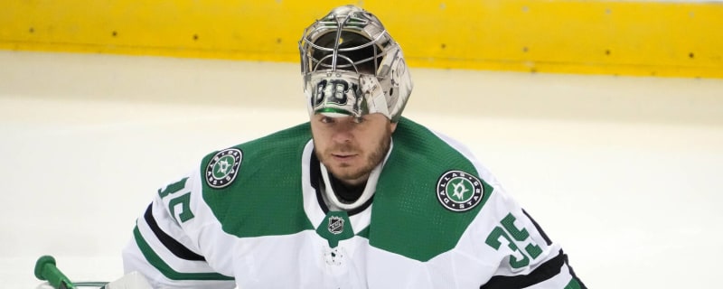 Houston Aeros Goalie Anton Khudobin (30) clears the puck to a team