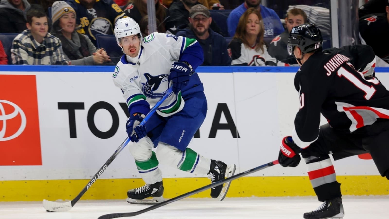 Conor Garland leads Canucks past Sabres in OT