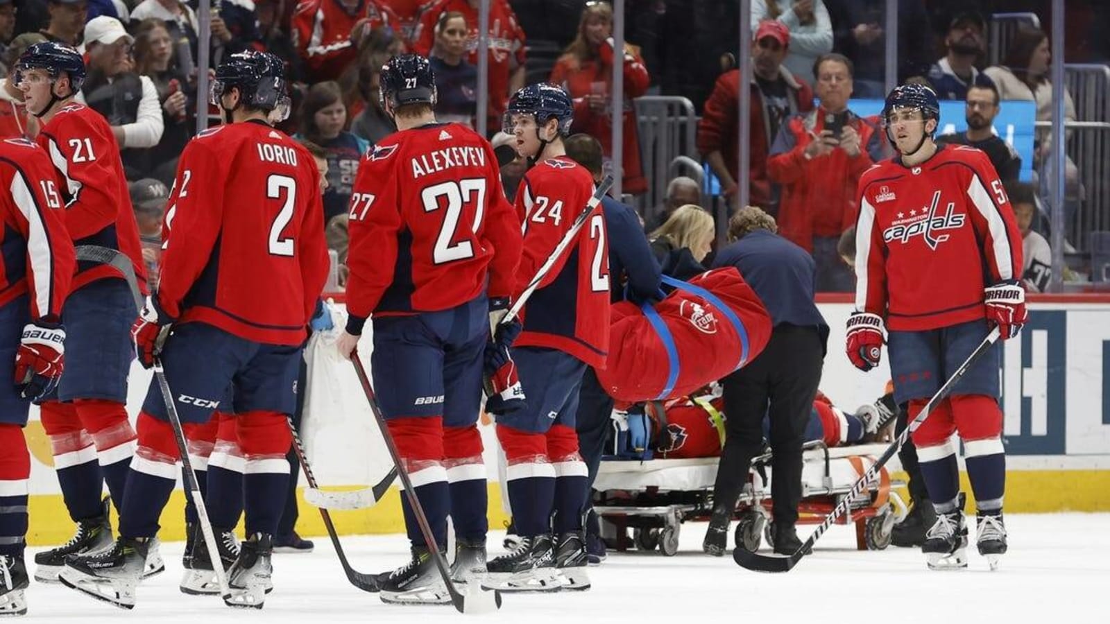 Capitals D Nick Jensen stretchered off after hard hit