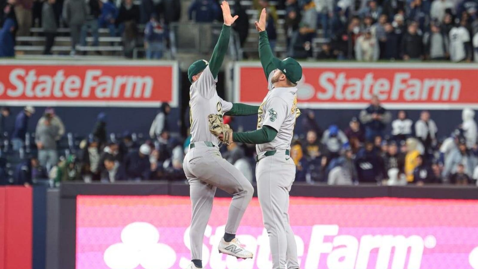 Athletics keep homers coming, earn series split with Yankees