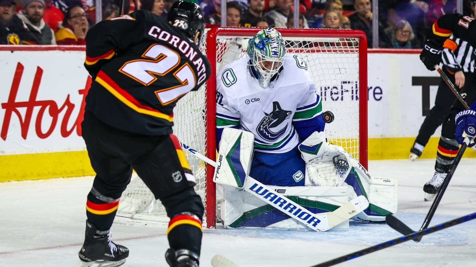 Flames get past Canucks, continue strong home form